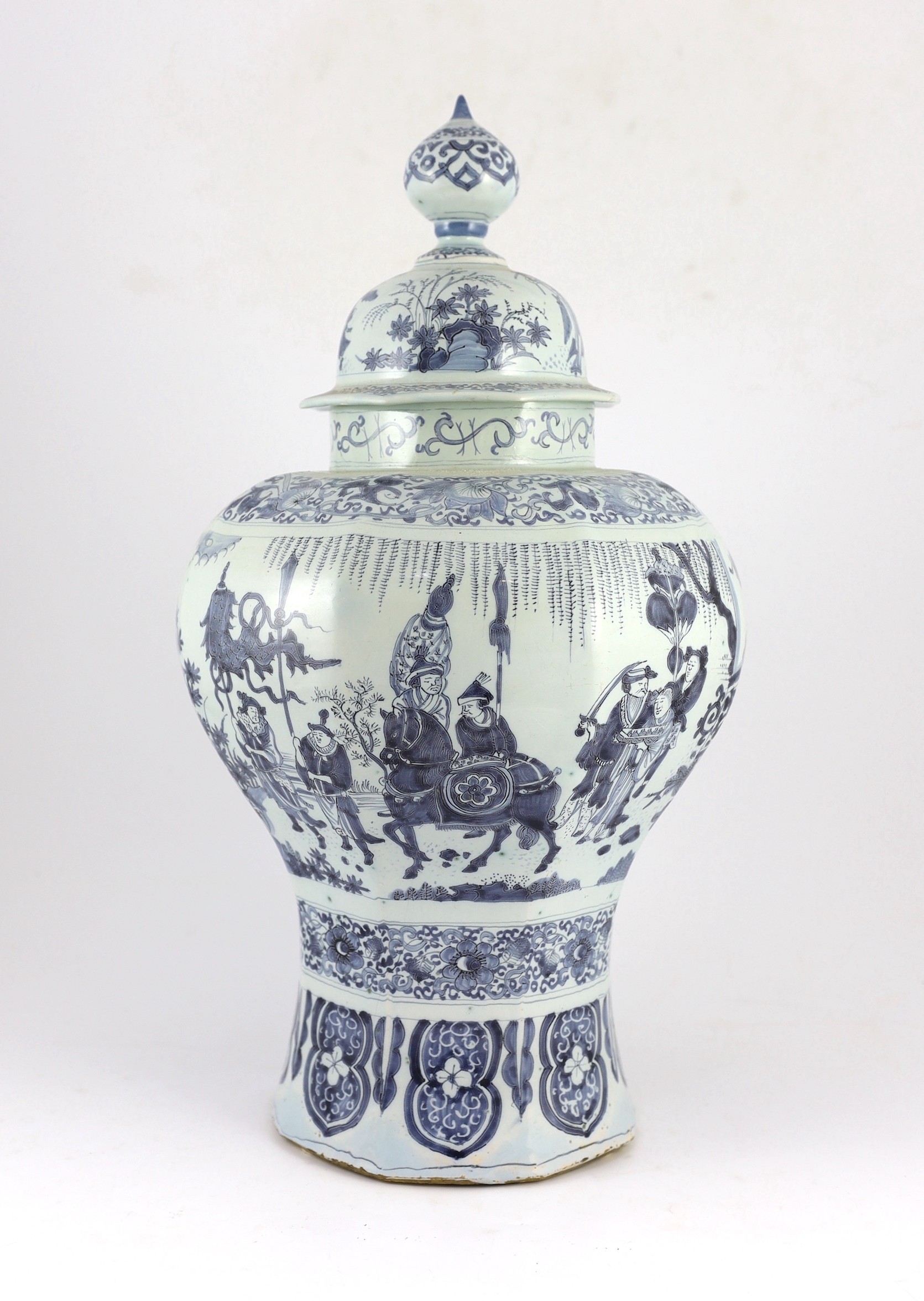 A massive Delft blue and white inverted baluster vase and cover, c.1700, 57.5cm high, neck and cover restored